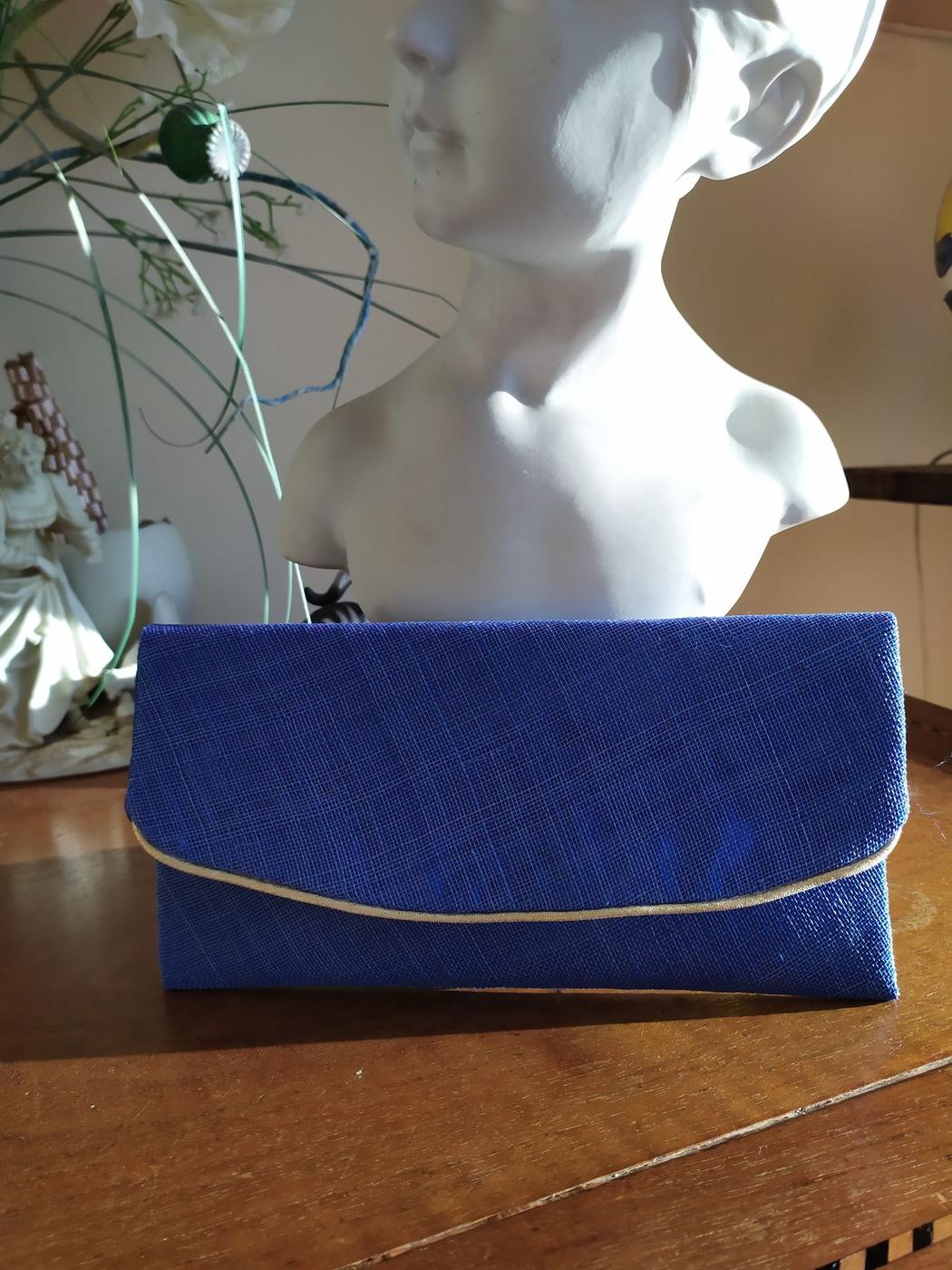 Pochette passepoil doré bleu marine